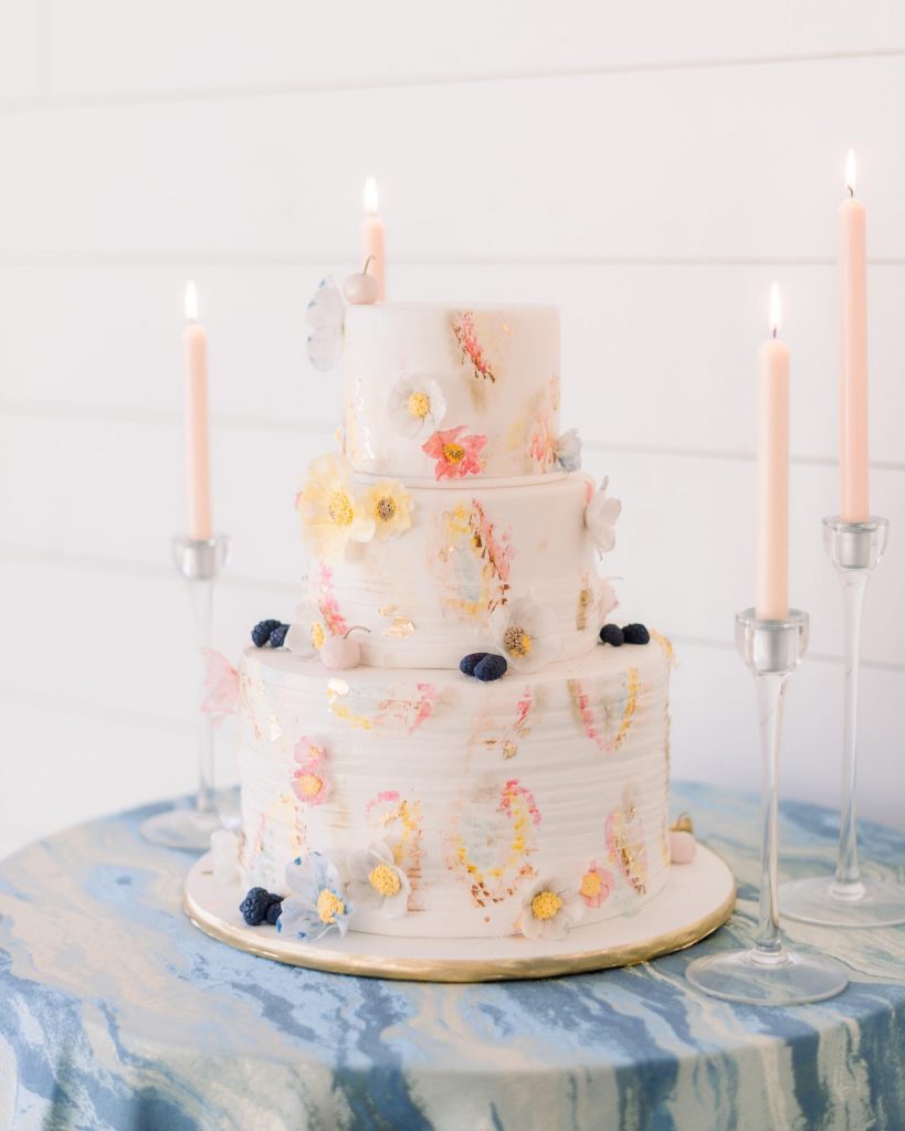 Love this cake design by cakesbyginahou⁠ for a springtime soiree!! Pretty pastels and beautiful blooms are always a good match.