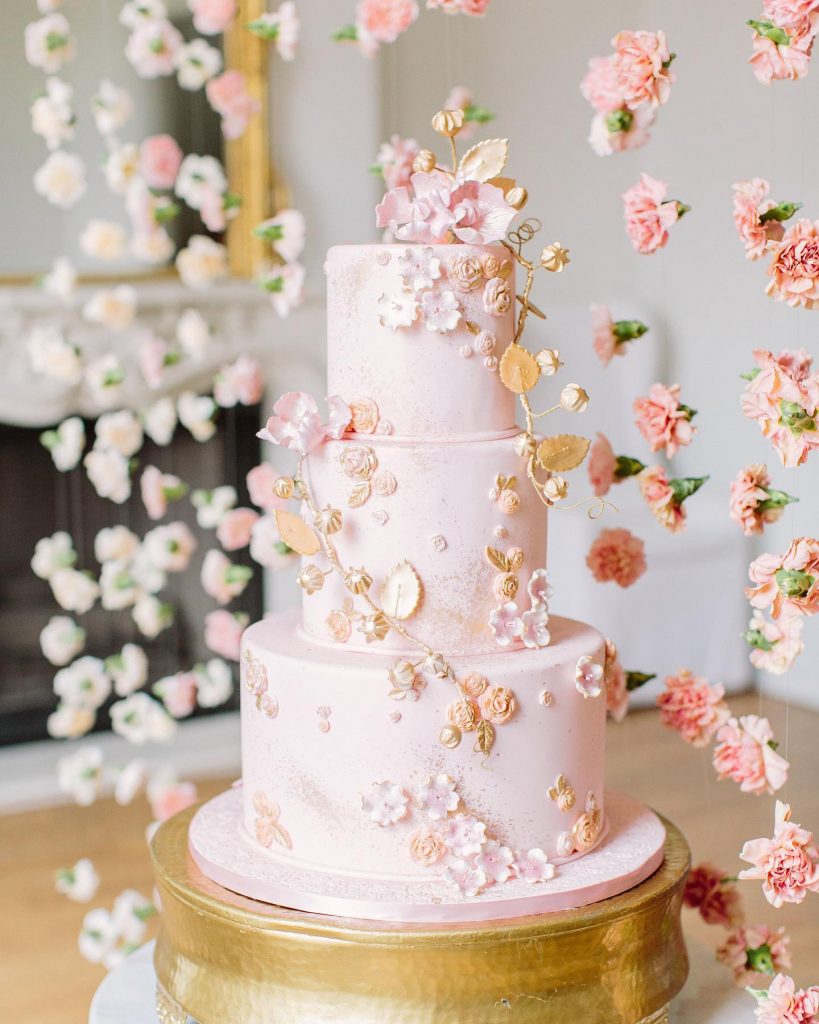 We desperately want a slice of this delicious-looking three-tiered treat from cakesbyginahou that was accented and surrounded by suspended floral