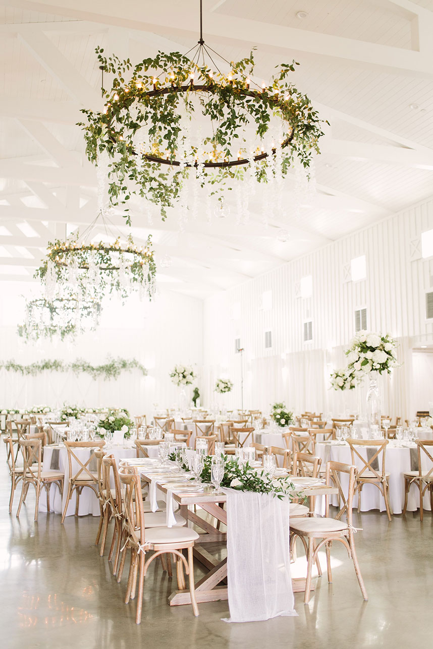 wood chairs with white tables wedding setup + tips for creating your guest list