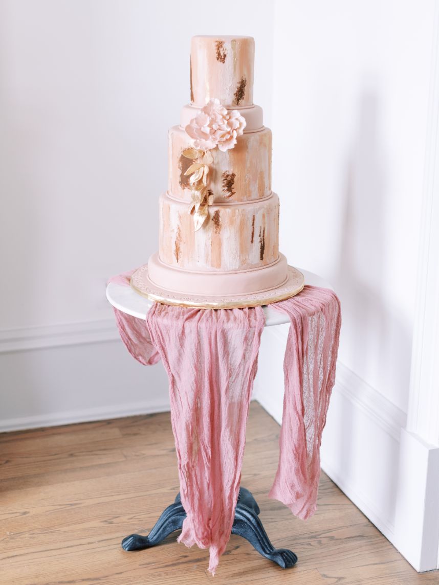 pink painted wedding cake