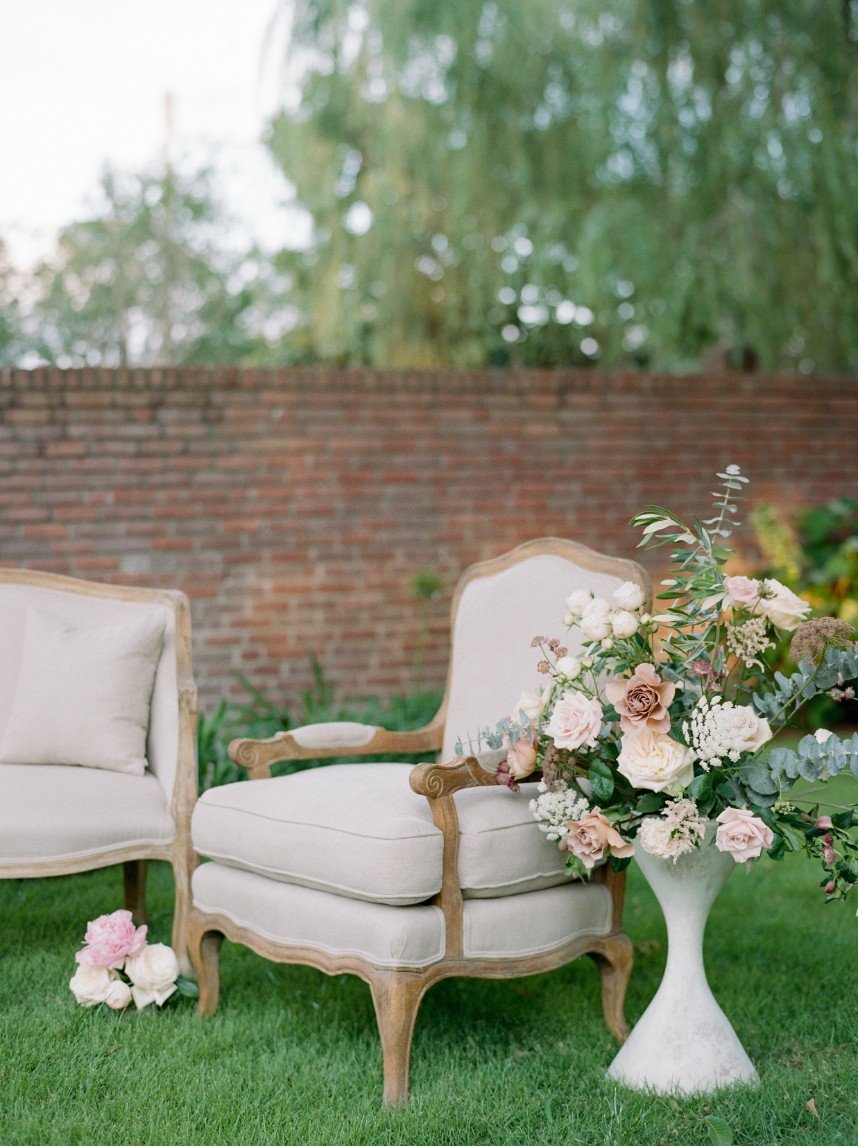 french country wedding vignette showing how guest count can affect wedding budget