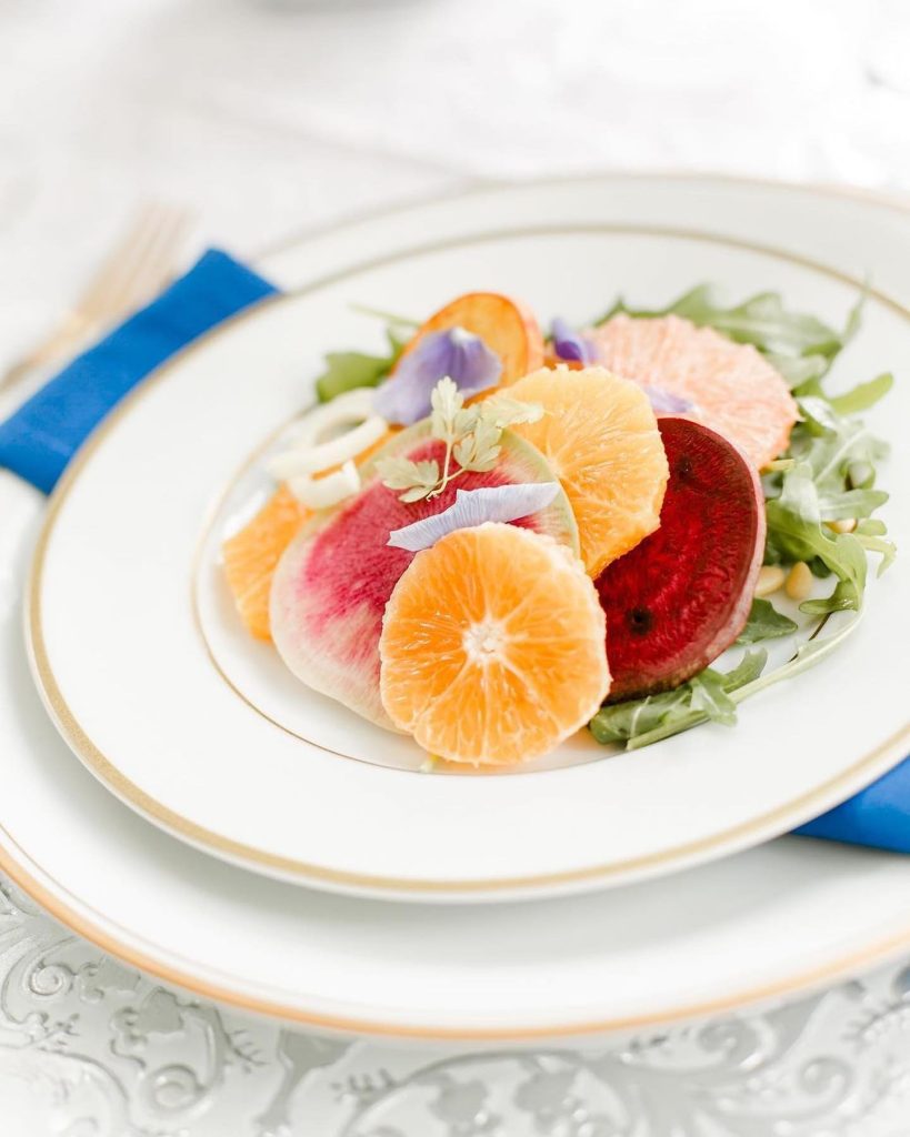 This is what salad dreams are made of! From the orange slices to the arugula base, this first-course plate by